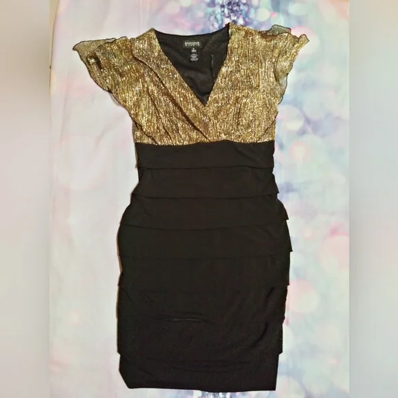 enfocus studio black dress Y2K Little Dress, High Low Design, Size 6 This beautiful preowned dress features a striking monochrome pattern that adds a playful twist to your wardrobe Womens Enfocus Studio Black Short